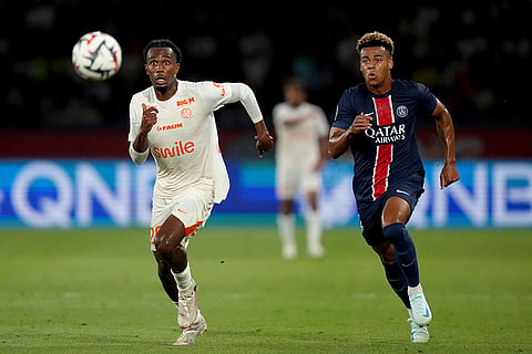 League 1, Paris Saint-Germain vs Montpellier: Enzo Tchato and PSG's Desire Doue, right, run after the ball 